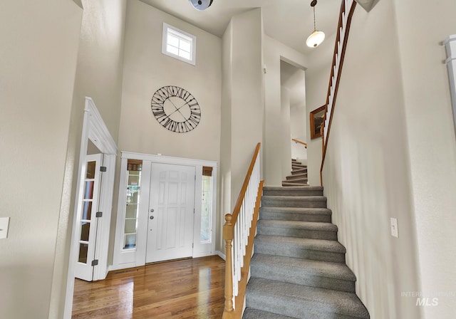 3031 N Christian Way, Meridian, ID 83646 - foyer entrance featuring stairs, wood finished floors, and a high ceiling