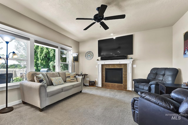 3031 N Christian Way, Meridian, ID 83646 - carpeted living area featuring healthy amount of natural light, a fireplace, a ceiling fan, and a textured ceiling