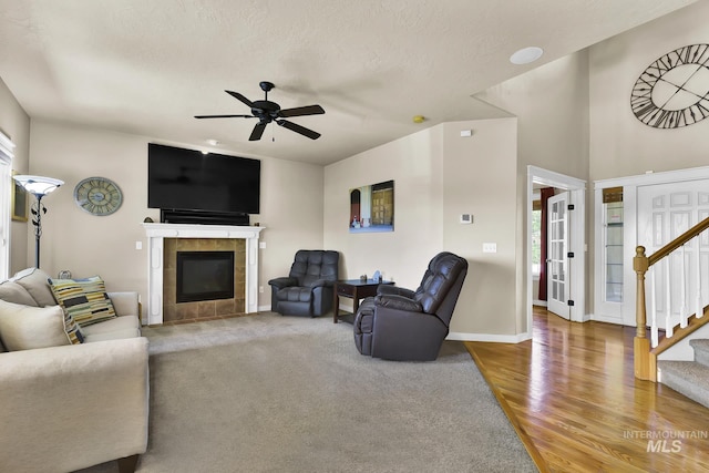 3031 N Christian Way, Meridian, ID 83646 - living room with stairs, ceiling fan, a fireplace, and wood finished floors