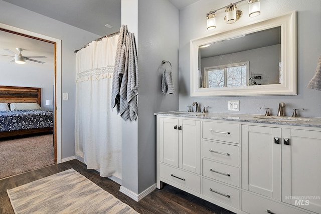 bathroom with vanity, wood-type flooring, and ceiling fan