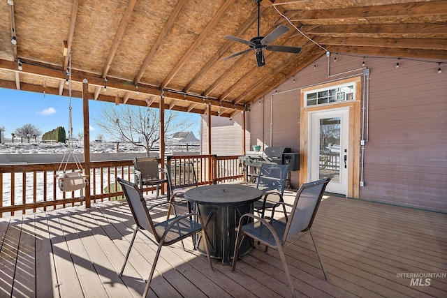 snow covered deck featuring ceiling fan