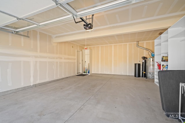 garage featuring a garage door opener and water heater