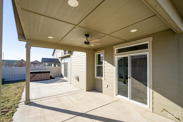 view of patio featuring a hot tub and ceiling fan