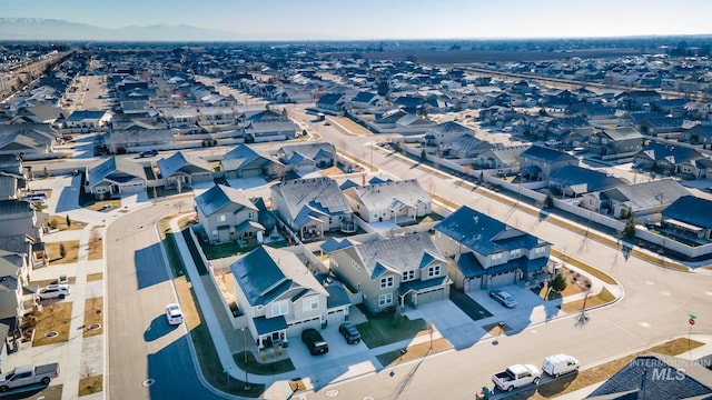 birds eye view of property featuring a mountain view