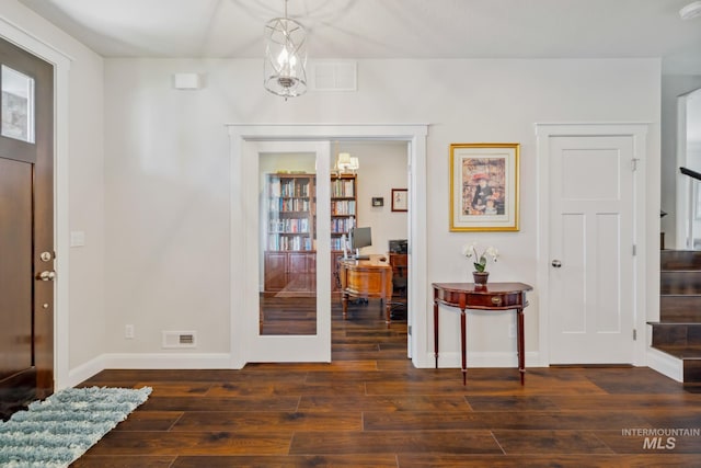12371 S Abbott Downing Way, Nampa, ID 83686 - entryway featuring stairway, visible vents, baseboards, and hardwood / wood-style flooring