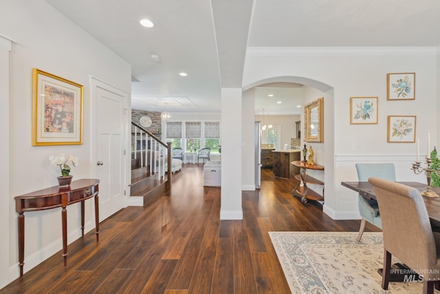 12371 S Abbott Downing Way, Nampa, ID 83686 - interior space with crown molding, arched walkways, stairway, baseboards, and dark wood-style floors