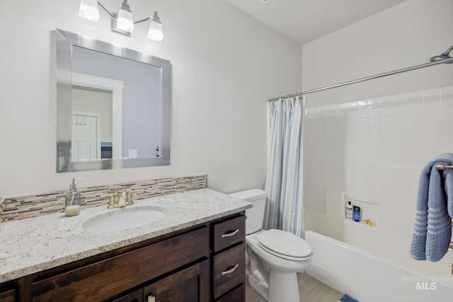 12371 S Abbott Downing Way, Nampa, ID 83686 - bathroom featuring toilet, shower / bath combo, and vanity