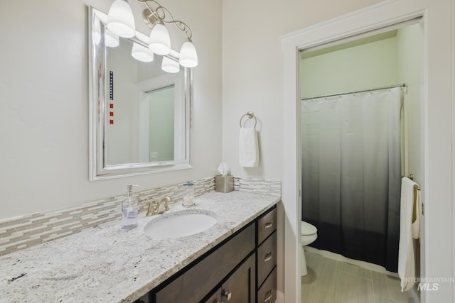 12371 S Abbott Downing Way, Nampa, ID 83686 - bathroom featuring vanity, a shower with curtain, and toilet