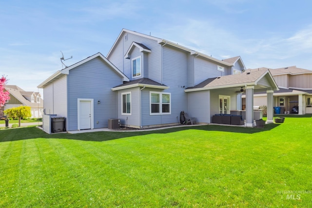 12371 S Abbott Downing Way, Nampa, ID 83686 - rear view of house featuring an outdoor living space, a ceiling fan, a lawn, central AC unit, and a patio area