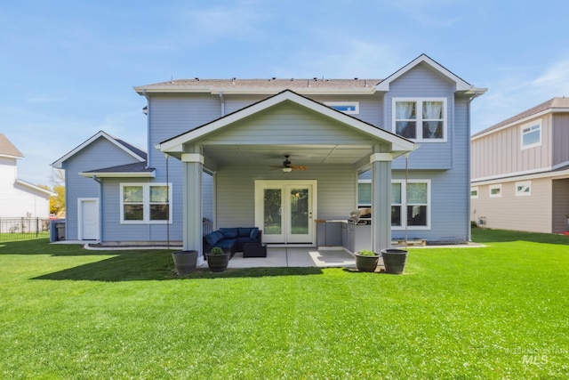 12371 S Abbott Downing Way, Nampa, ID 83686 - back of house with french doors, a ceiling fan, a patio, and a yard