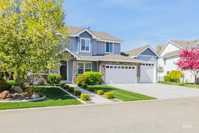 12371 S Abbott Downing Way, Nampa, ID 83686 - view of front of house featuring concrete driveway, board and batten siding, an attached garage, and stone siding
