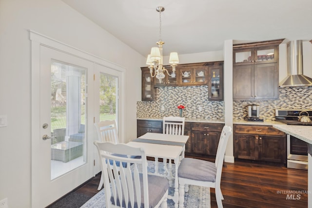 12371 S Abbott Downing Way, Nampa, ID 83686 - dining area featuring an inviting chandelier and dark wood-style flooring