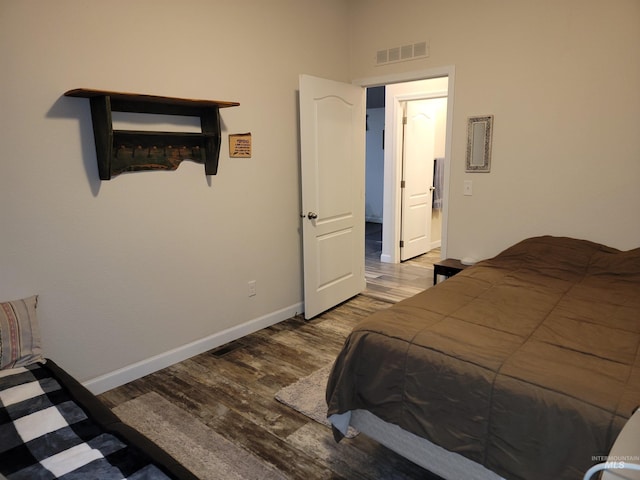 bedroom featuring hardwood / wood-style floors