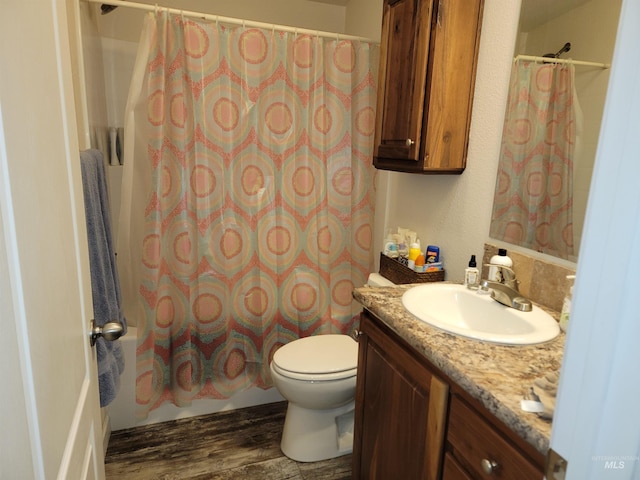 full bathroom with vanity, shower / bathtub combination with curtain, wood-type flooring, and toilet