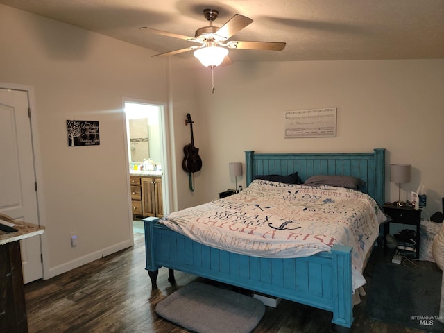 bedroom featuring ensuite bathroom, vaulted ceiling, ceiling fan, and dark wood-type flooring