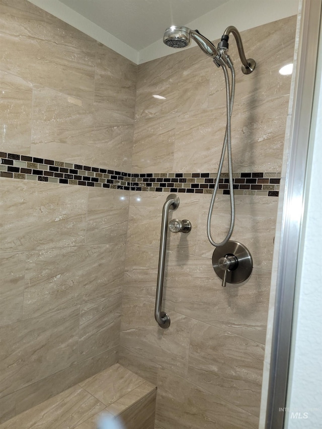 bathroom featuring tiled shower