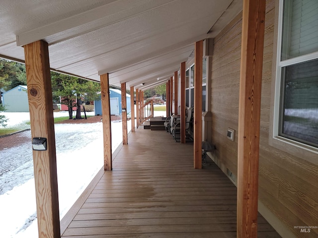 wooden deck featuring covered porch