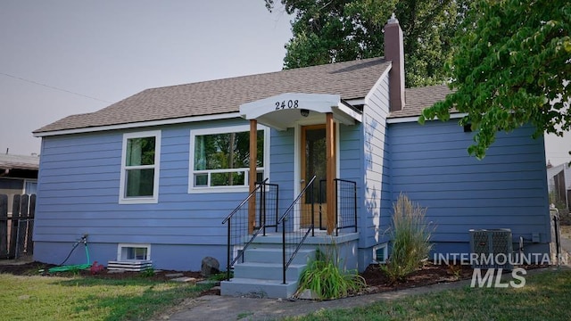 view of front of house featuring central air condition unit