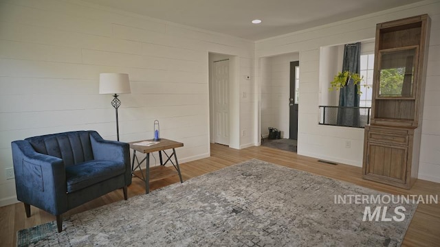 sitting room featuring hardwood / wood-style floors