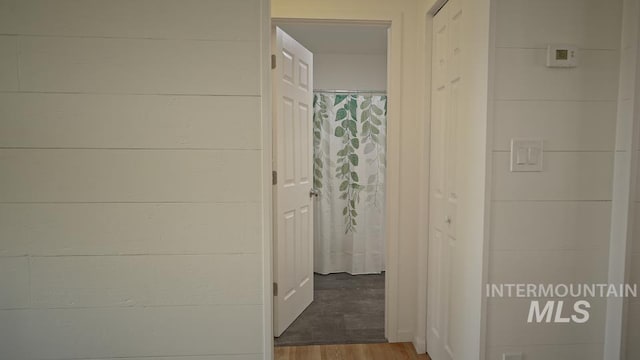 corridor featuring hardwood / wood-style floors