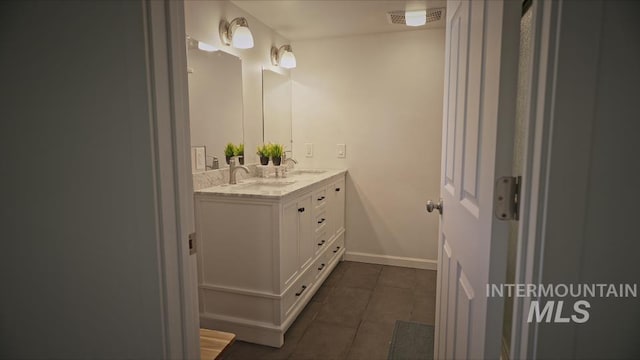 bathroom featuring tile patterned floors and vanity