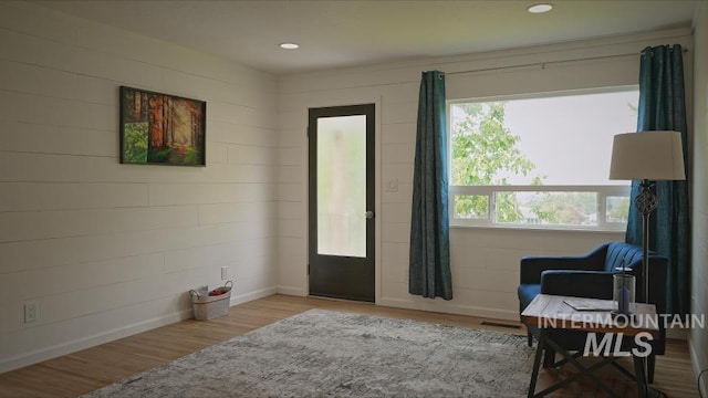 living area with light hardwood / wood-style flooring