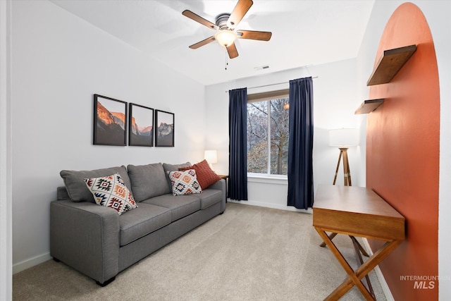 living room with light carpet and ceiling fan