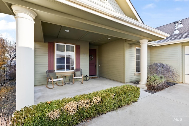 view of exterior entry featuring a porch