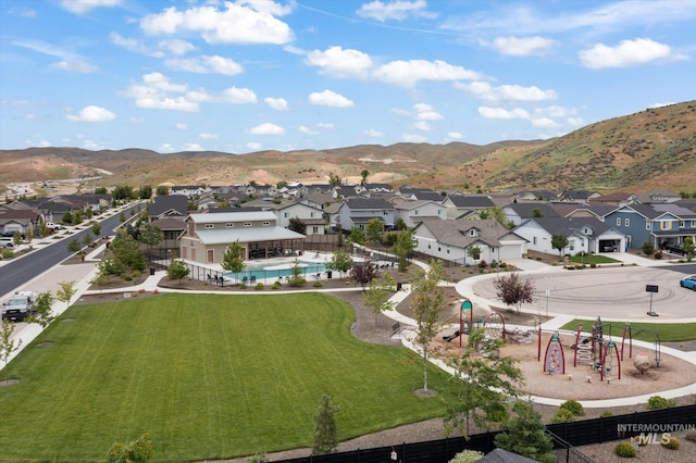 birds eye view of property with a mountain view