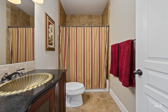 bathroom with toilet, tile patterned flooring, and vanity