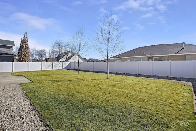 view of yard featuring a fenced backyard