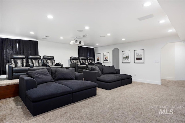 cinema featuring recessed lighting, light colored carpet, and baseboards