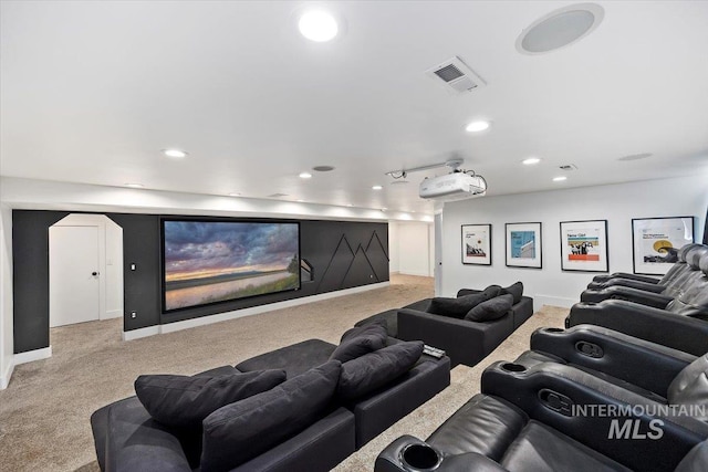 home theater with recessed lighting, light colored carpet, visible vents, and baseboards