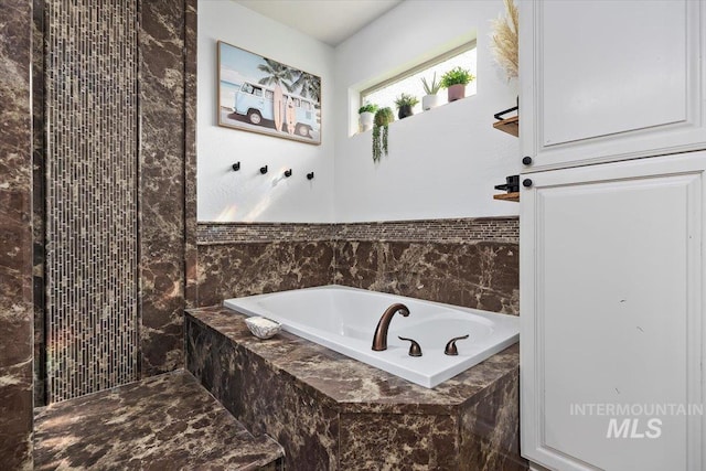 bathroom featuring a garden tub