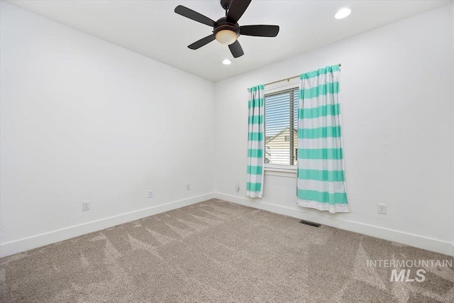 carpeted spare room with a ceiling fan, recessed lighting, visible vents, and baseboards