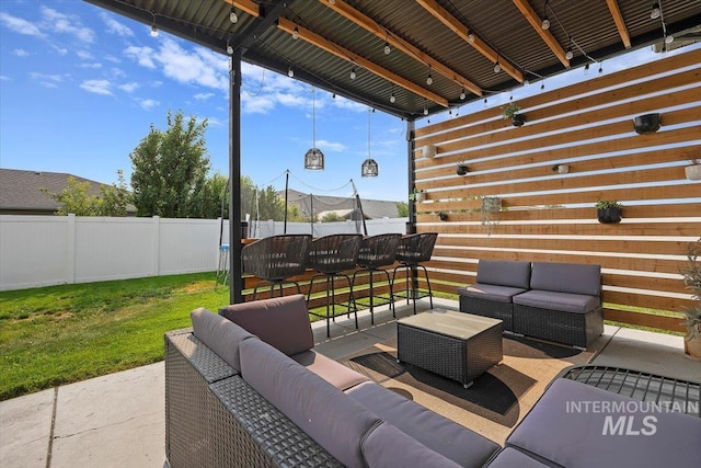 view of patio / terrace with fence and an outdoor living space