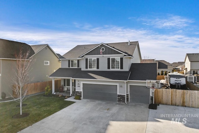 view of property with a garage and a front lawn