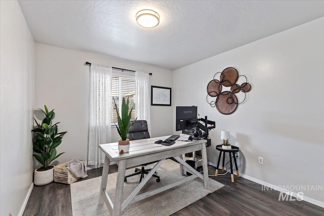 office area featuring a textured ceiling and dark hardwood / wood-style floors