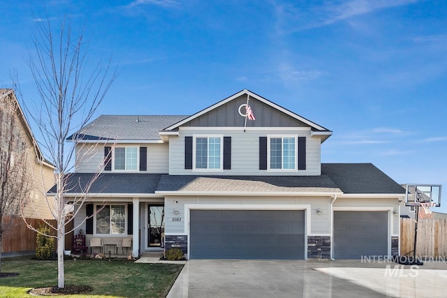 view of front of home with a front yard and a garage