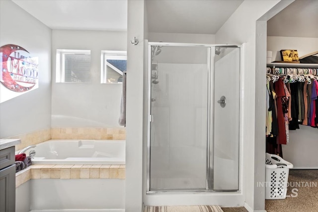 bathroom with separate shower and tub and vanity