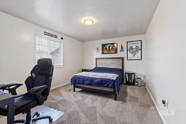 carpeted bedroom with a textured ceiling