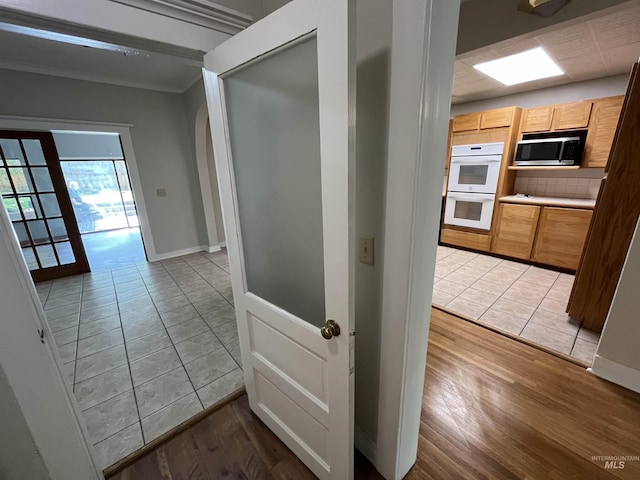 909 E 6th, Moscow, ID 83843 - hall featuring ornamental molding, light wood-style floors, and baseboards