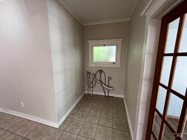 909 E 6th, Moscow, ID 83843 - laundry room featuring washer hookup, electric dryer hookup, light tile patterned floors, crown molding, and baseboards