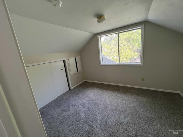 909 E 6th, Moscow, ID 83843 - bonus room with vaulted ceiling, carpet flooring, and baseboards