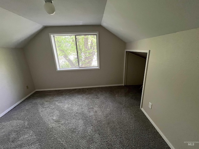 909 E 6th, Moscow, ID 83843 - additional living space featuring lofted ceiling, carpet floors, and baseboards