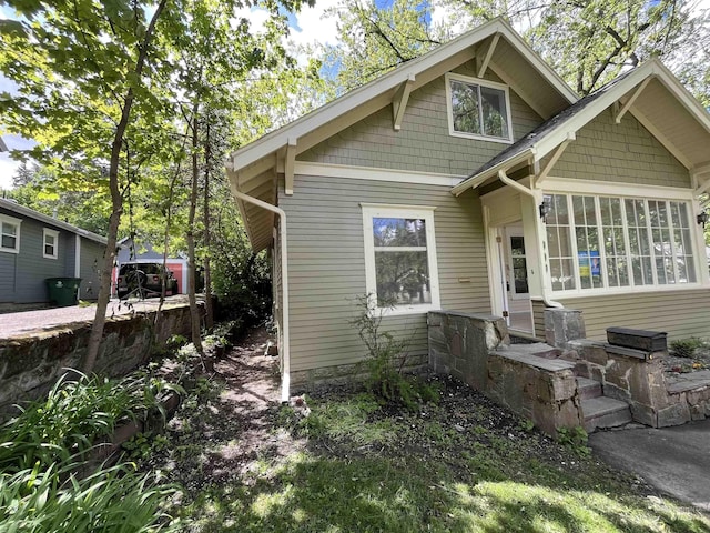 909 E 6th, Moscow, ID 83843 - back of house featuring a sunroom