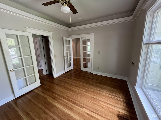 909 E 6th, Moscow, ID 83843 - spare room featuring french doors, a ceiling fan, wood finished floors, baseboards, and ornamental molding