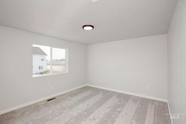 11179 Cart St, Caldwell, ID 83605 - spare room with visible vents, light carpet, and baseboards