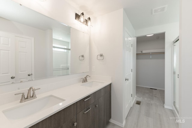 11179 Cart St, Caldwell, ID 83605 - full bath featuring double vanity, visible vents, and a sink