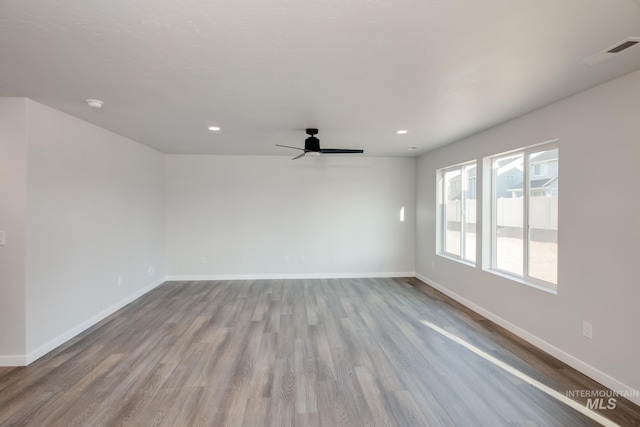 11179 Cart St, Caldwell, ID 83605 - spare room featuring wood finished floors, visible vents, and baseboards